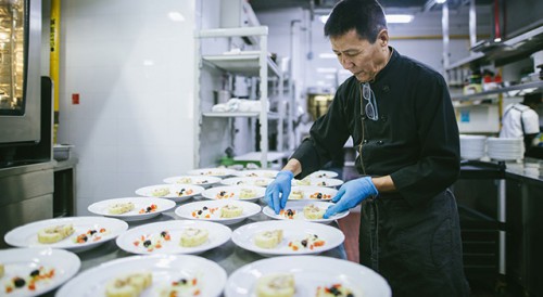 Macao chef preparing dishes featuring influences from China and the Portuguese-speaking Countries