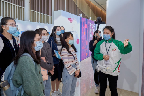 Macao Polytechnic Institute students acting as interns to the Cultural Week, provide translation and exhibition guided-tour services