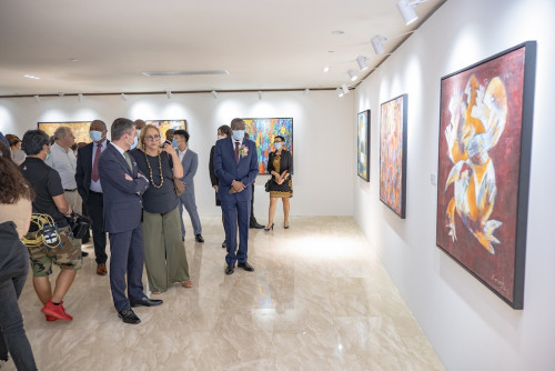 Visitors enjoy artwork at the exhibition