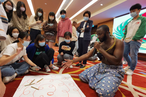 Young people take part in a workshop featuring traditional Guinean games