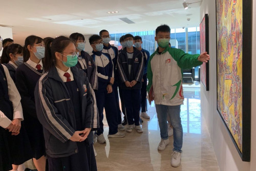 A student delegation from Lou Hau High School visits the exhibition